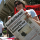 Delegates hold posters and a newspaper against the Iraq war, at the World Social Forum in Nairobi Monday, Jan. 22, 2007.The World Social Forum was first held in Brazil in 2001 and coincides each year with the market-friendly World Economic Forum of political and business leaders in Davos, Switzerland.